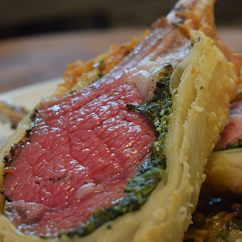 Sliced beef Wellington with a pink centre and golden pastry